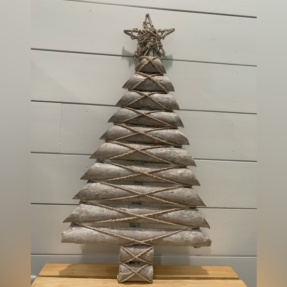 Coastal beach holiday decor, white distressed wood Christmas tree with star.